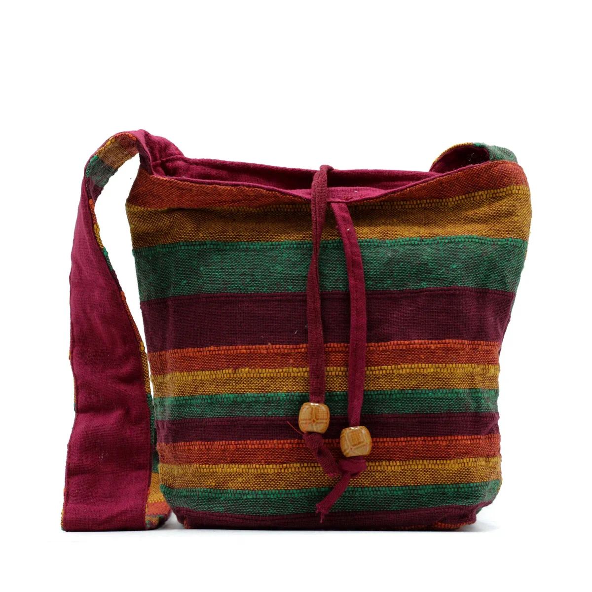 Tan and green sling bag with multiple compartments, designed for mountain trekking and everyday use