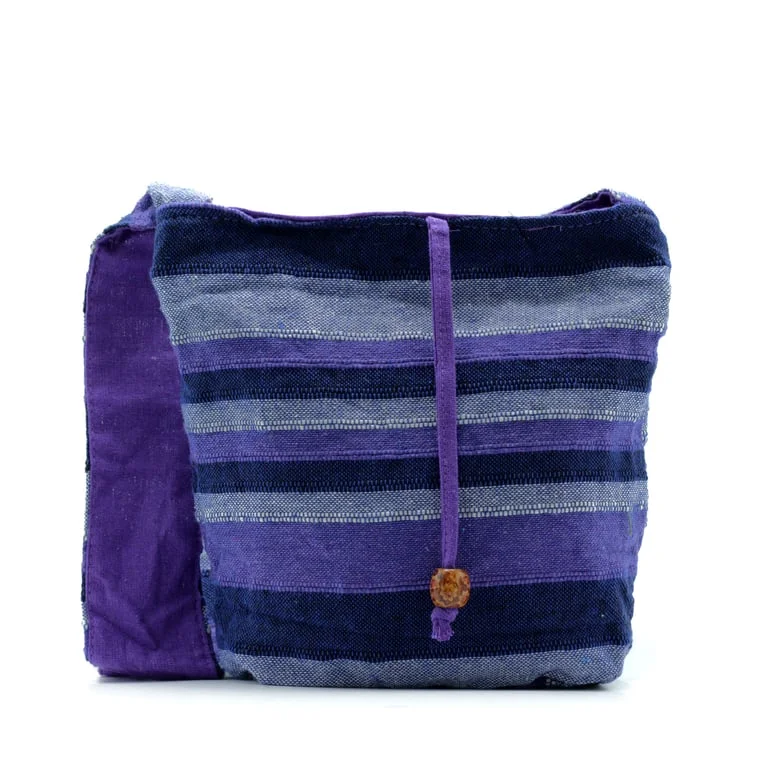 nepal sling bag in deep sea blue, front view of the bag showing its simple, contemporary design.