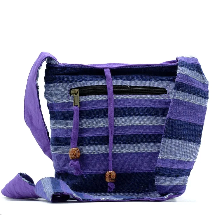Neal sling bag in deep sea blues bag, with smooth fabric, adjustable strap, front pocket, zipper, subtle logo.