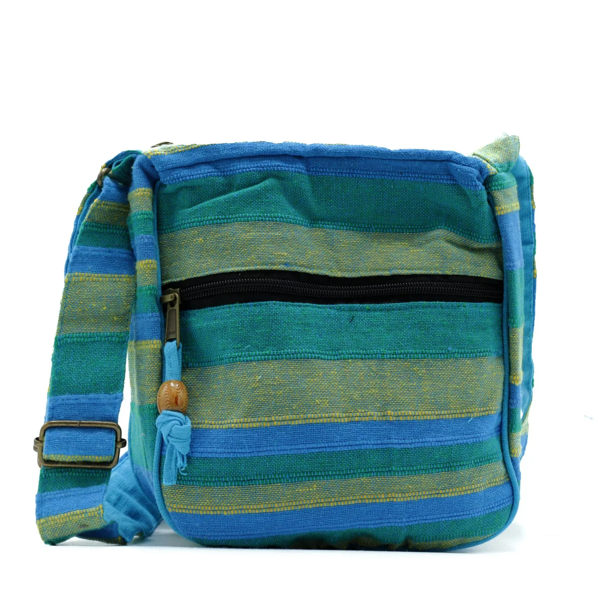 Large sling bag in spring meadows green and blue with adjustable strap, designed for versatile everyday use