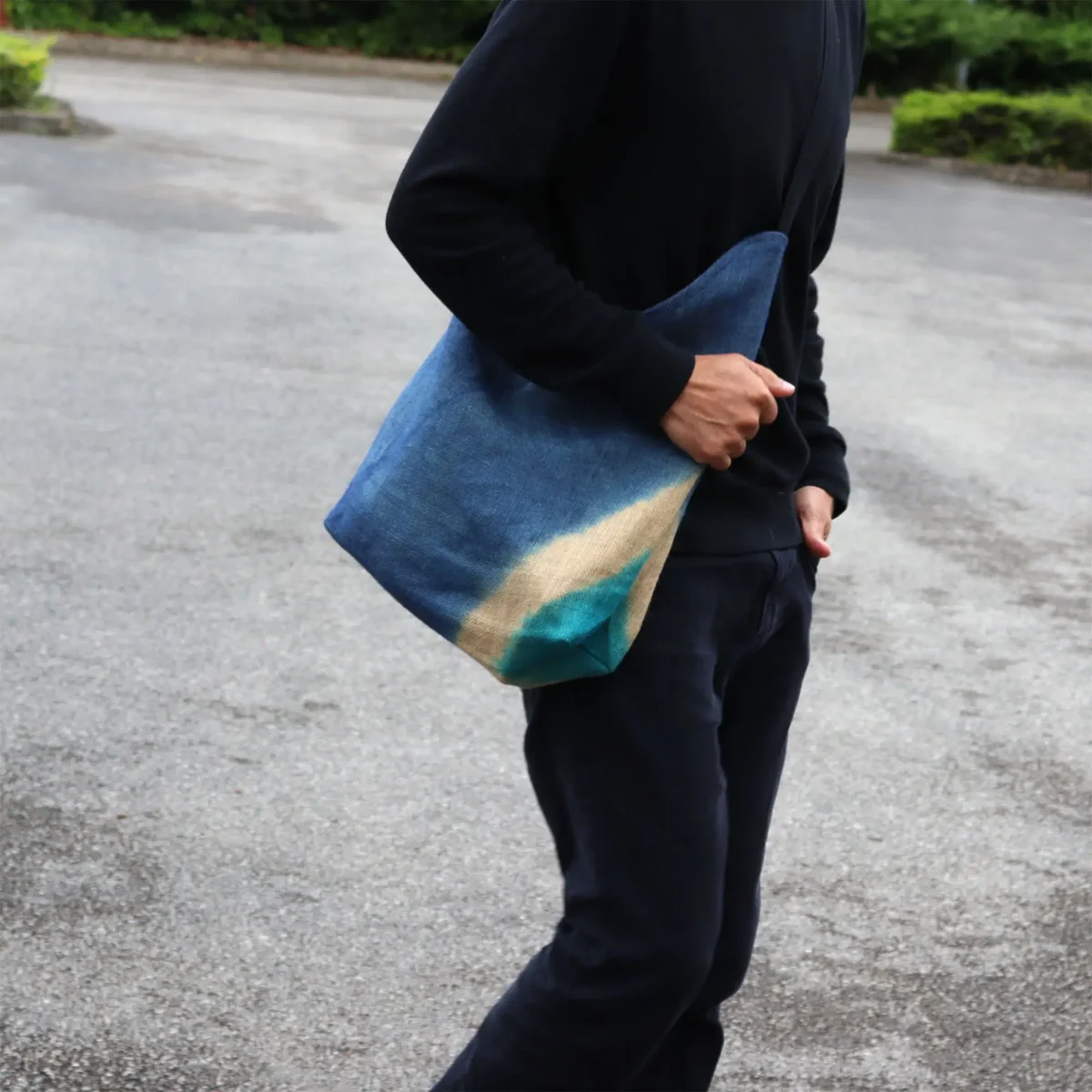 Denim blue soft blend tote bag with shoulder straps, simple and casual design on plain background