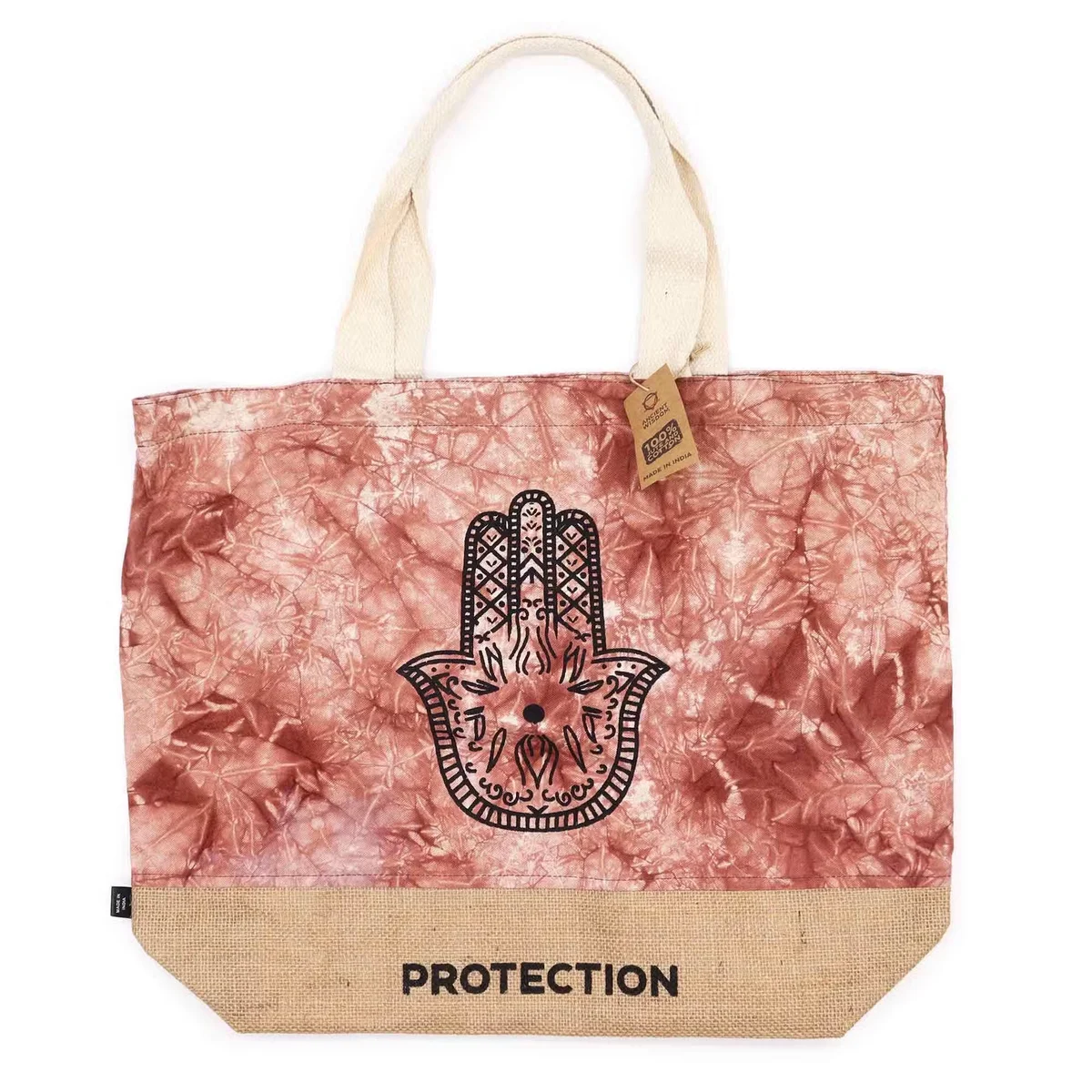 Terracotta stonewash all natural hamsa protection bag with intricate hand design on fabric surface, folded on plain background
