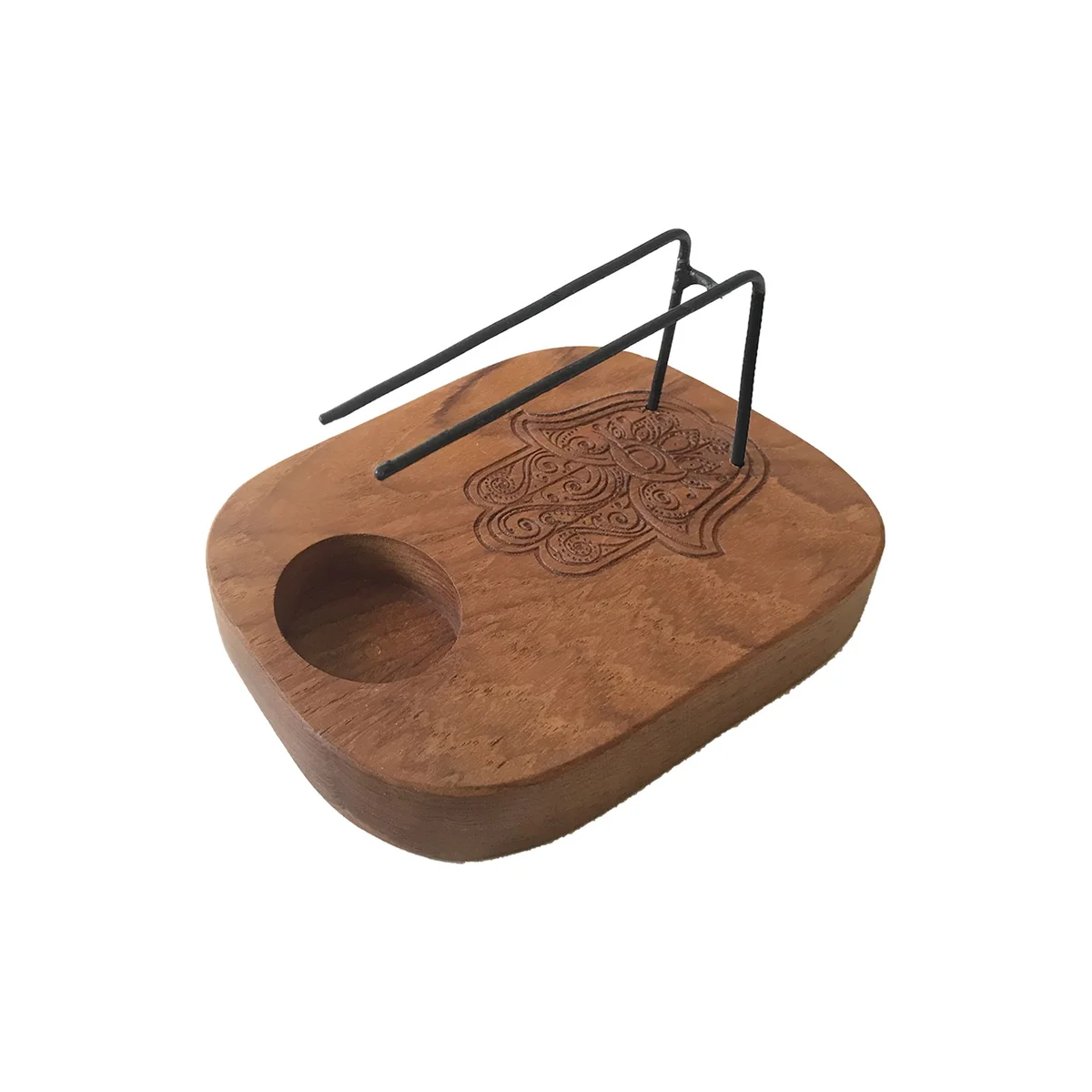 Palo santo heater crafted from teak wood with a detailed Hamsa pattern.