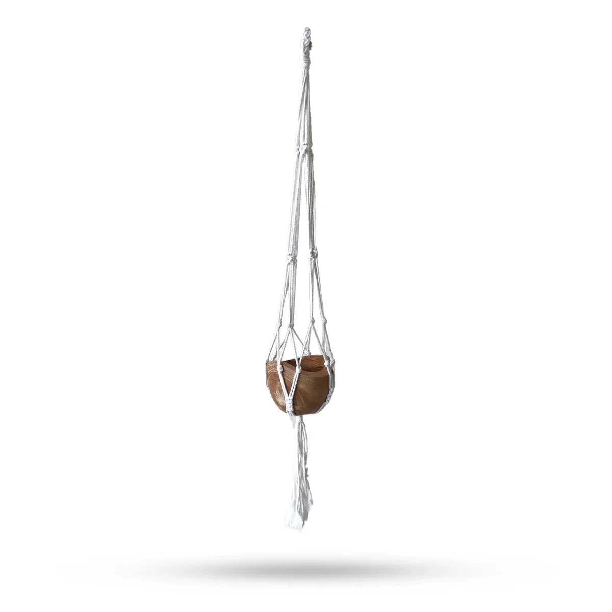 Mid‑size natural pot holder made of knotted cord, hanging on a wooden wall hook.