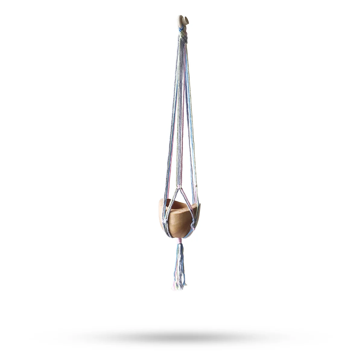 Macrame bathroom pot holder in pastel tones holding a medium bathroom pot.