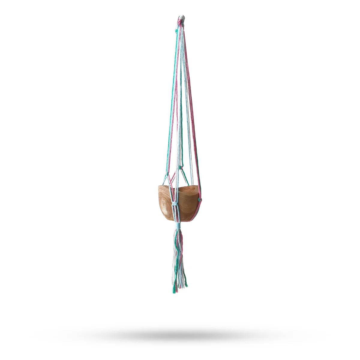 Classic macrame holder with pastel tones holding a medium terracotta pot