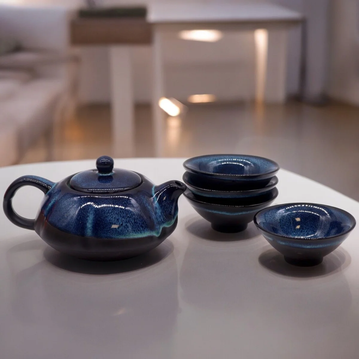 Herbal Blues teapot set with a pot and four matching blue cups