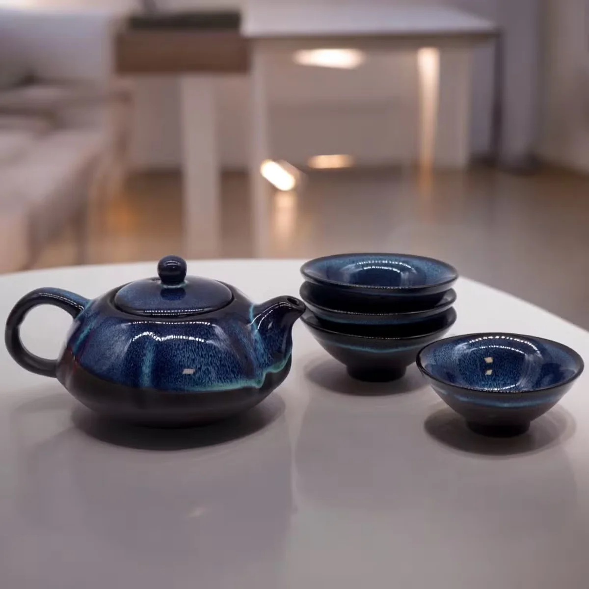 Ceramic teapot set with herbal blue pot and four matching cups