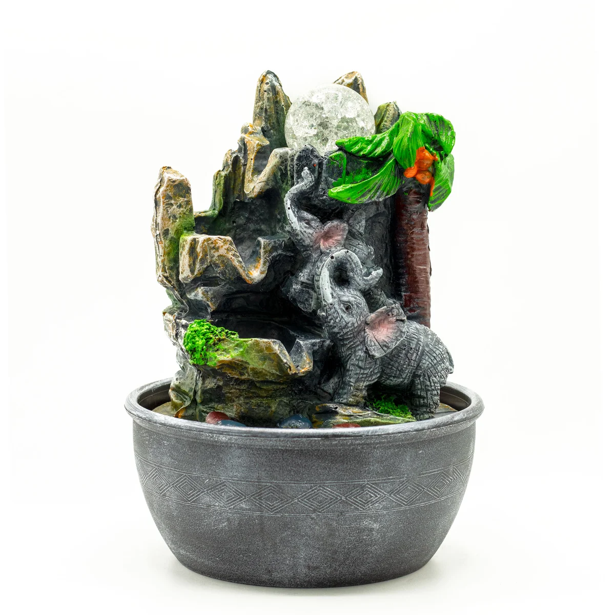 Indoor water feature on a tabletop showing 25cm elephant figures beside a palm tree.