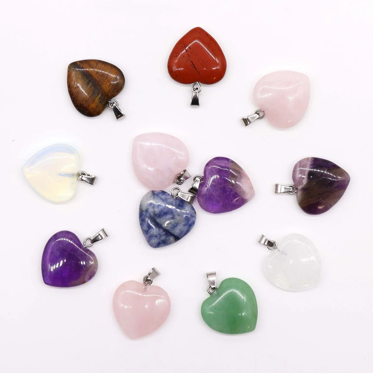 12 assorted gemstone heart pendants, 20mm across, 6mm tall, displayed together on a flat surface.