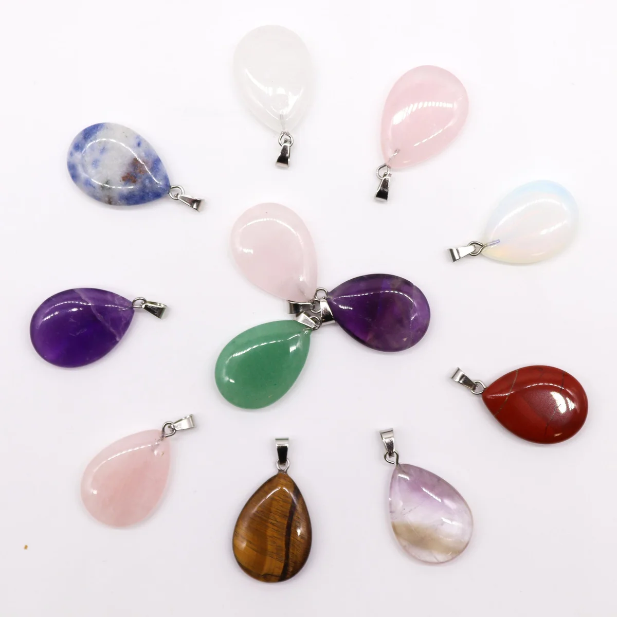 Assorted gemstone teardrop necklace charms, 12 pieces displayed, each 25x18 mm.