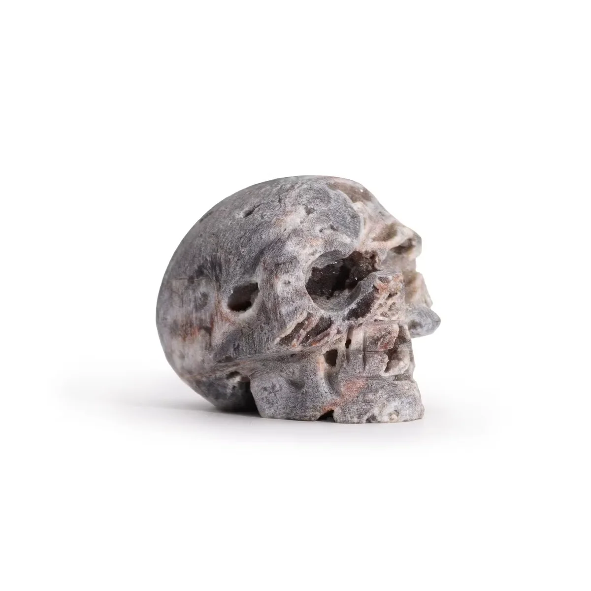 Natural stone skull carved from calcite geode.