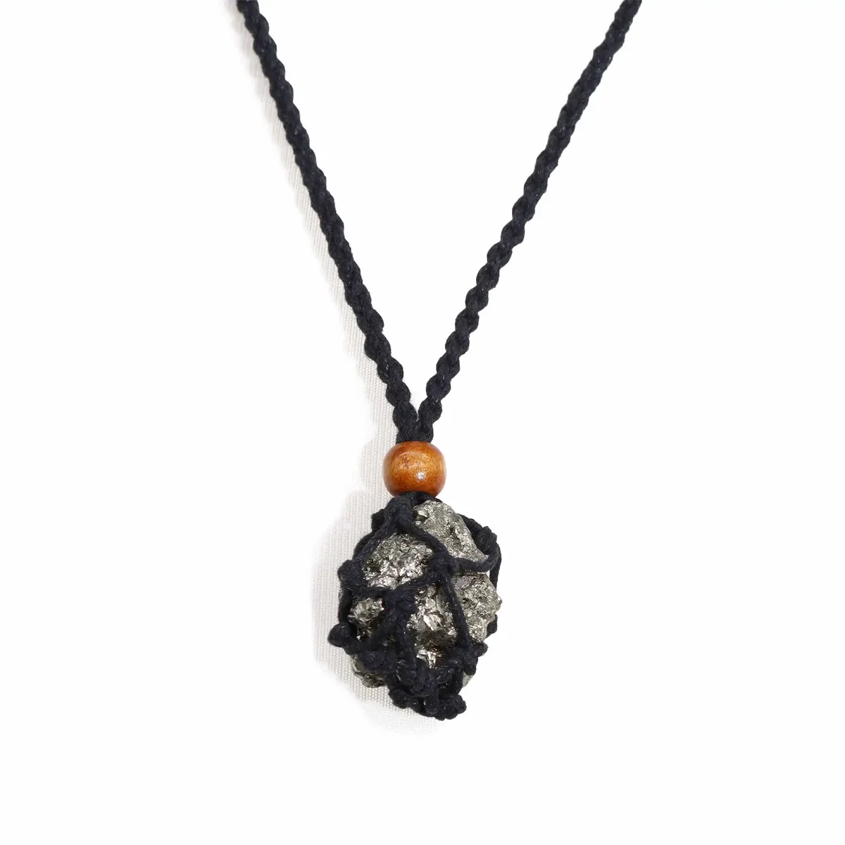 Black gemstone necklace cord displayed coiled on a white background for jewelry making or repair.