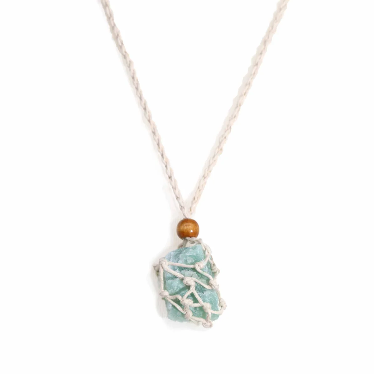 Close-up of natural necklace cord made from gemstone beads, showcasing texture and color variations on a white background