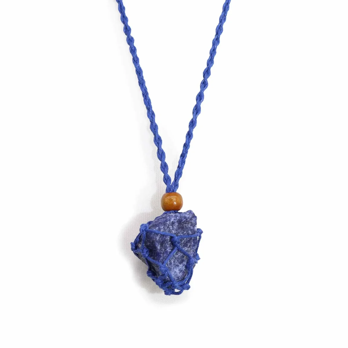 Navy blue gemstone necklace cord neatly coiled on a white background