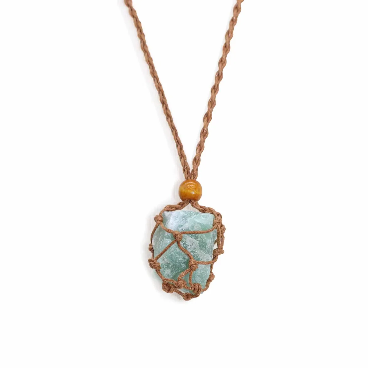 Brown necklace cord for gemstones displayed coiled on a white background