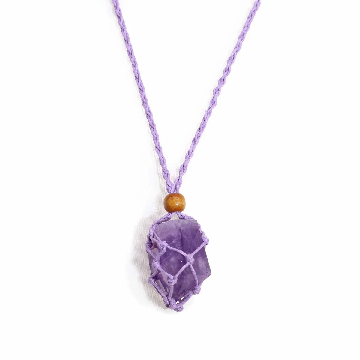 Purple gemstone necklace cord displayed against a plain background, showing its texture and color details.