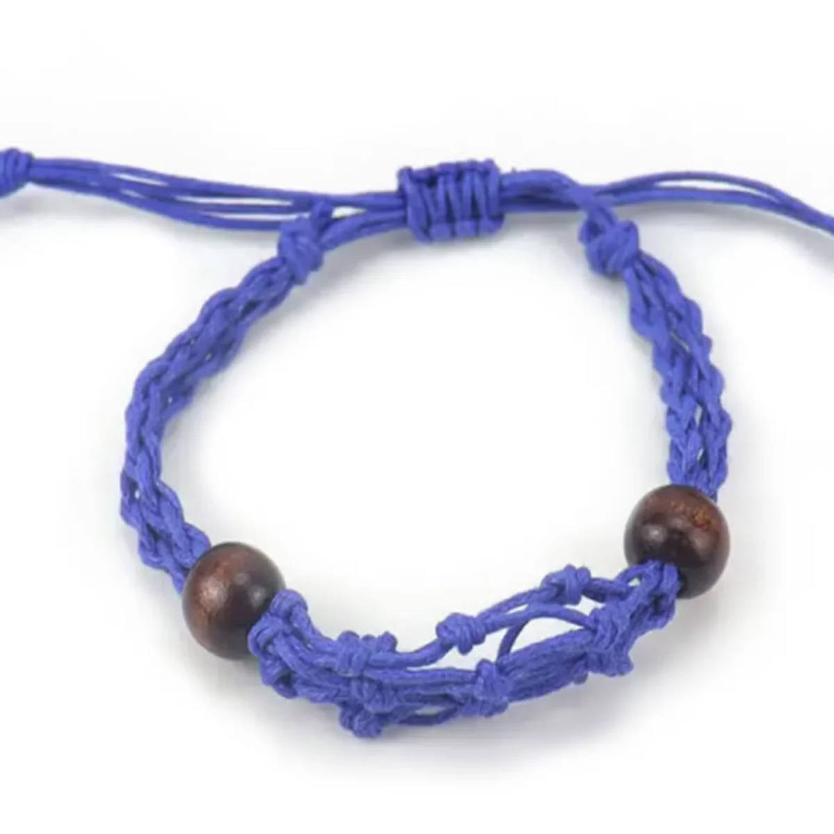 Navy blue bracelet cord for gemstones displayed coiled against a white background for crafting jewelry