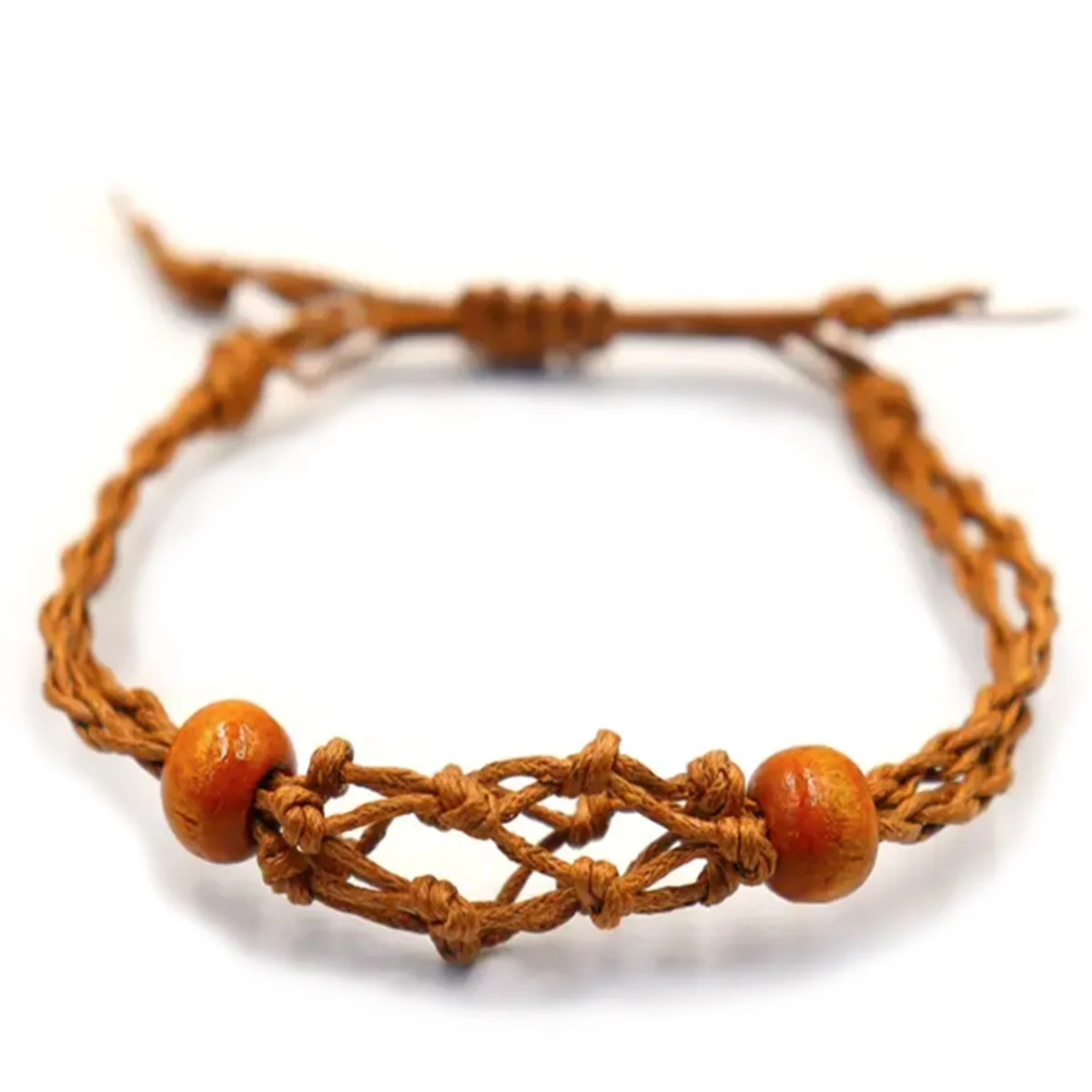 Brown gemstone bracelet cord coiled on a white background showing texture and color details