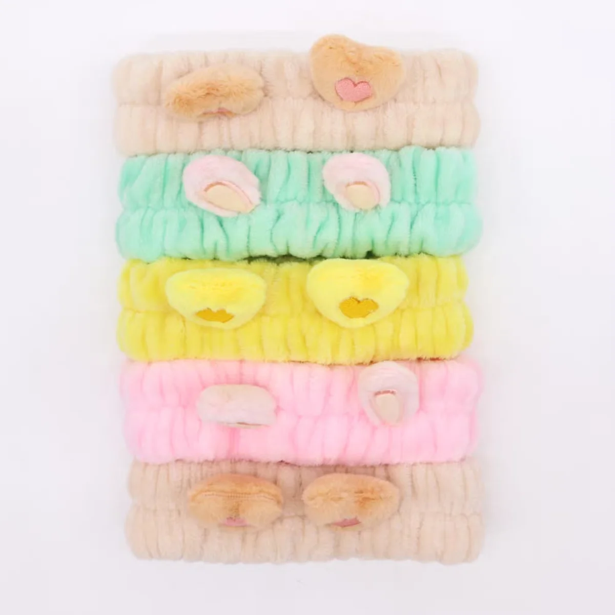 Assorted cute makeup headbands with hearts and ears designs, stylish hair bands for beauty routines and daily wear
