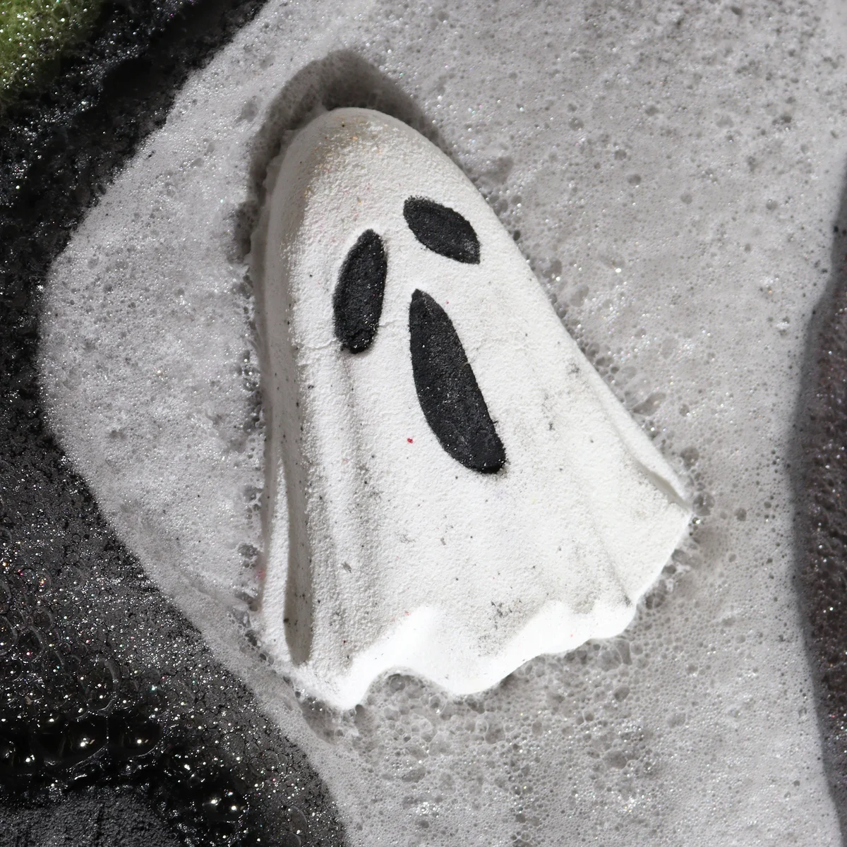 White ghost-shaped Halloween bath bomb 65g on a plain background for festive bath time fun