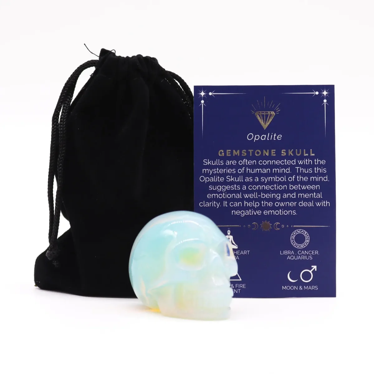 Large gemstone skull carved from opalite with smooth, polished surface and translucent milky appearance