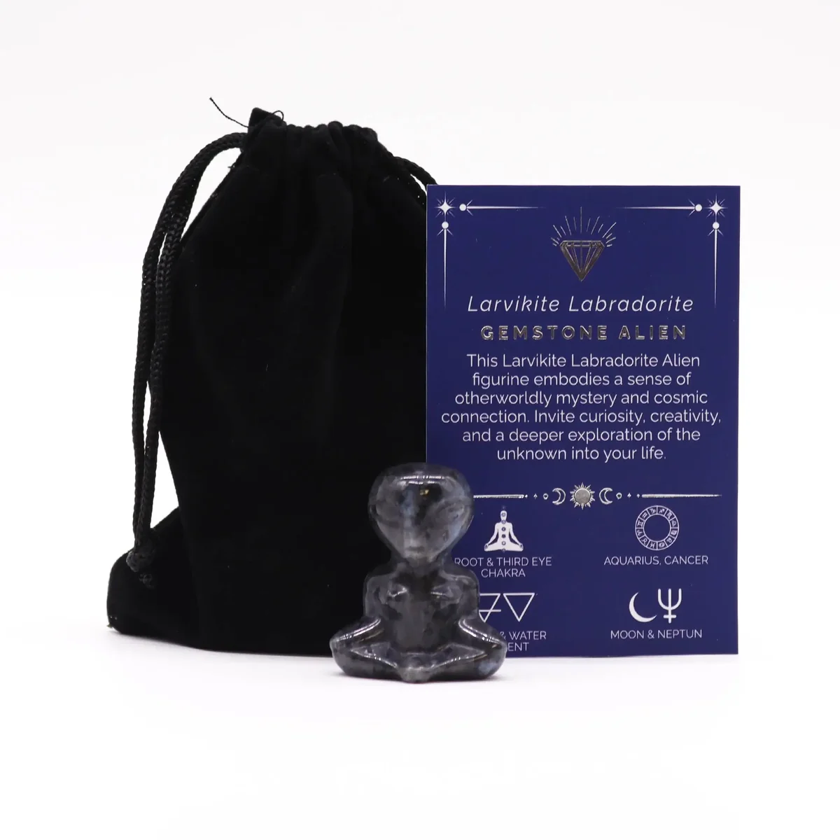 Stylish larvikite gemstone figurine shaped like an alien, with shimmering iridescent surface reflections.