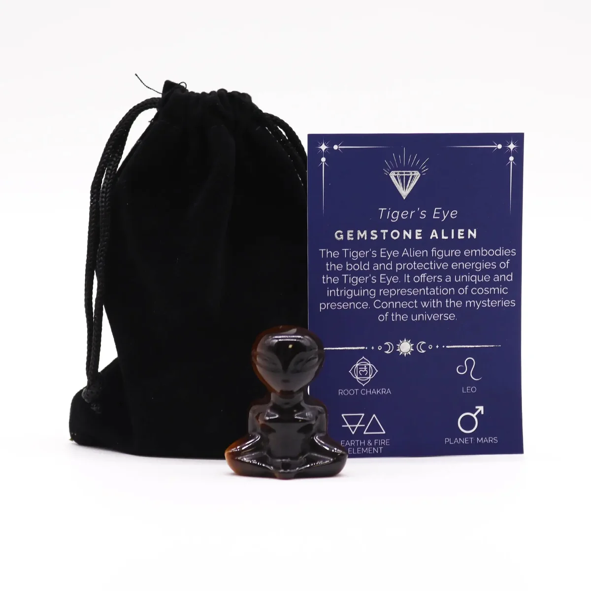 Alien figurine decor made of tiger eye gemstone, with a smooth rounded shape and subtle golden flecks