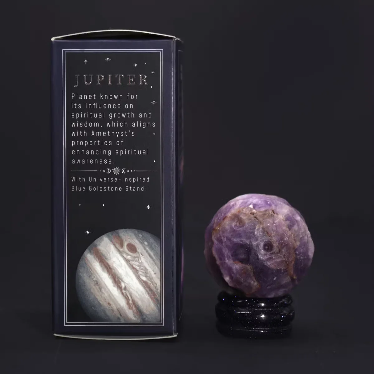 Jupiter planet ornament featuring a clear amethyst globe atop a goldstone stand.