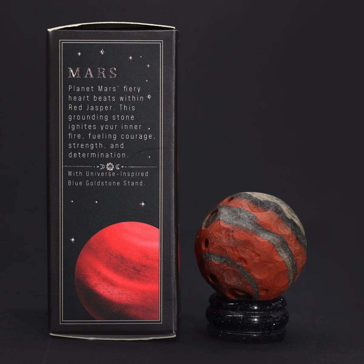 Red jasper planet ornament perched on a Sola Goldstone stand, a distinctive decorative stone accessory
