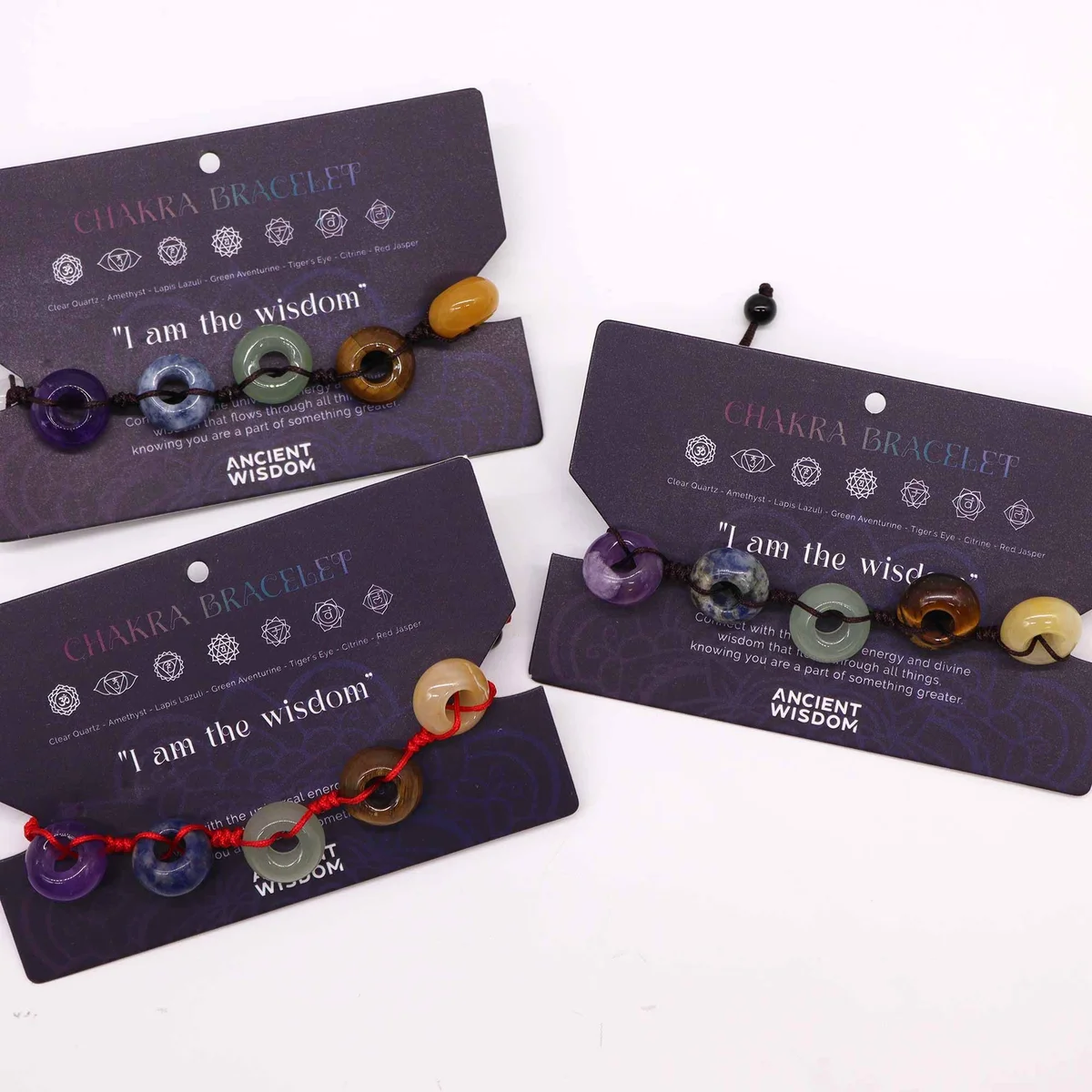 Chakra string bracelet featuring colorful beads arranged in a ball design on a string band