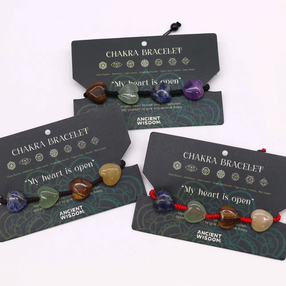 Chakra string bracelet featuring heart charms in vibrant colors, a piece of chakra jewellery for balancing energy