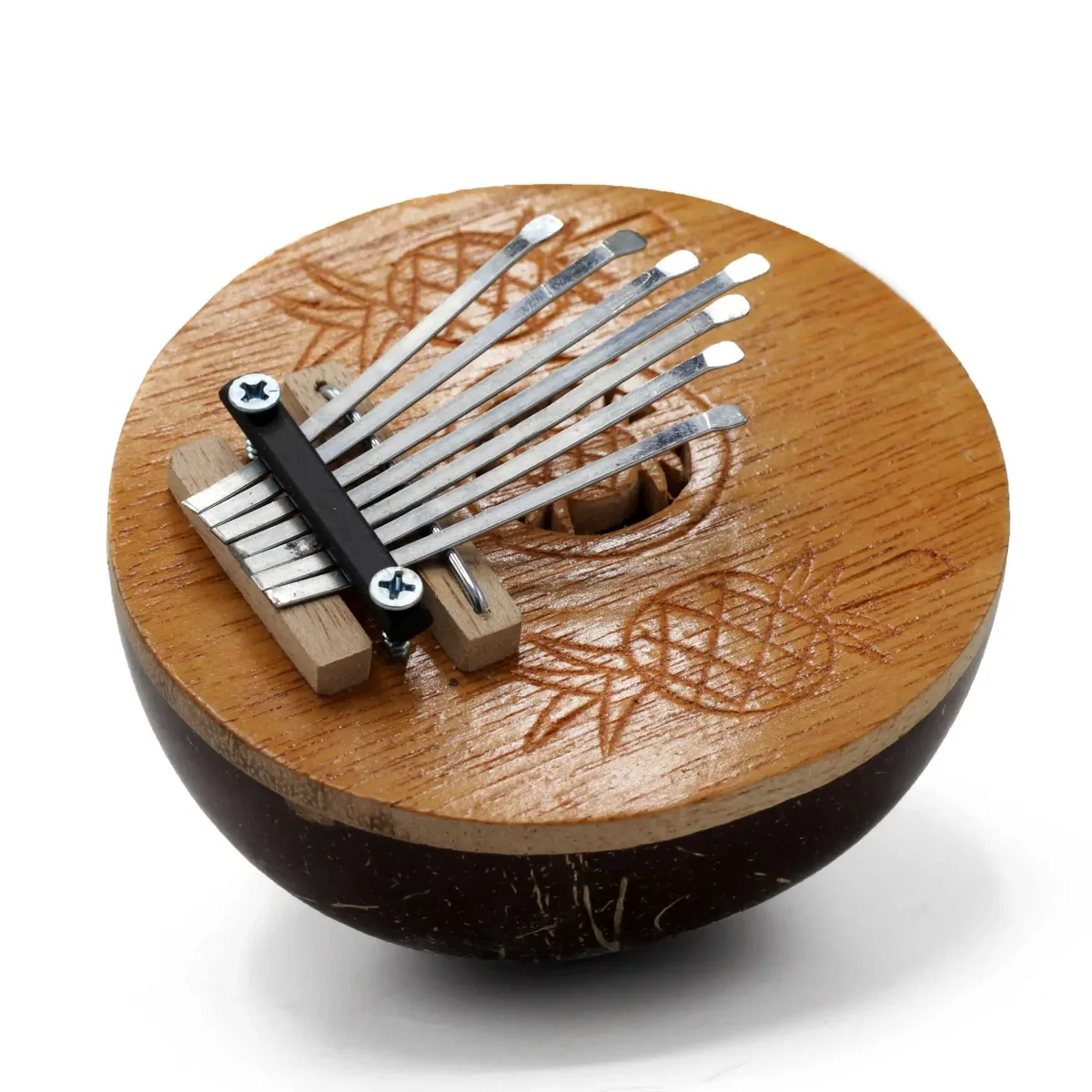 Compact Kalimba musical instrument made from a mini coconut shell with metal tines for playing melodies