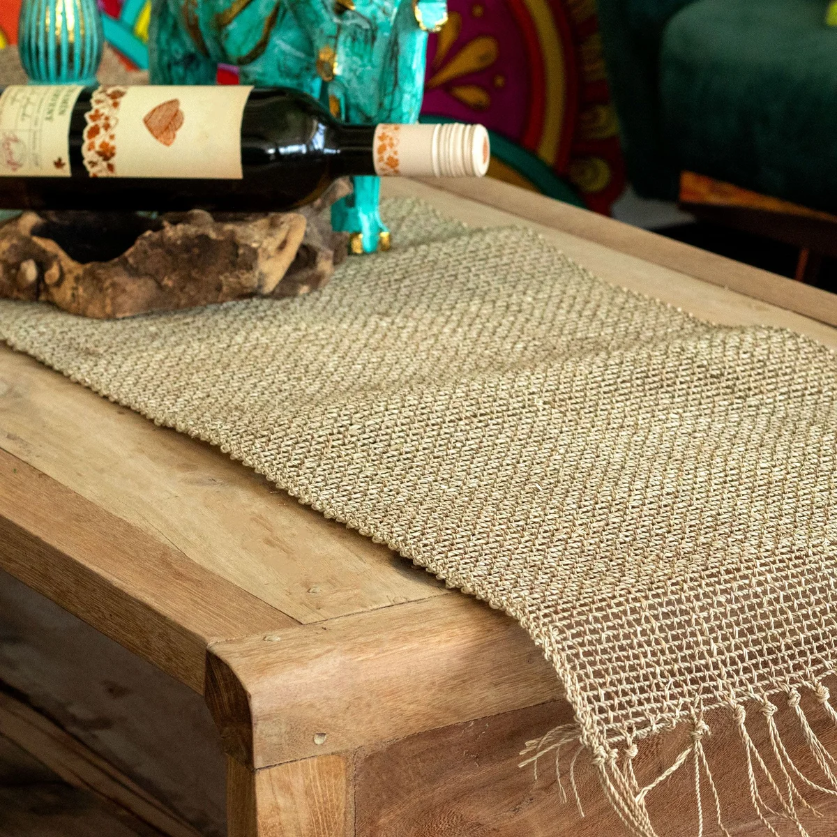 Seagrass fringe natural table runner 150cm laid flat showing woven texture and fringed edges on a white background