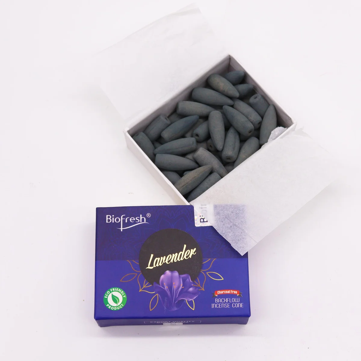 Biofresh backflow incense cones arranged with lavender flowers, highlighting lavender scented incense cones packaging