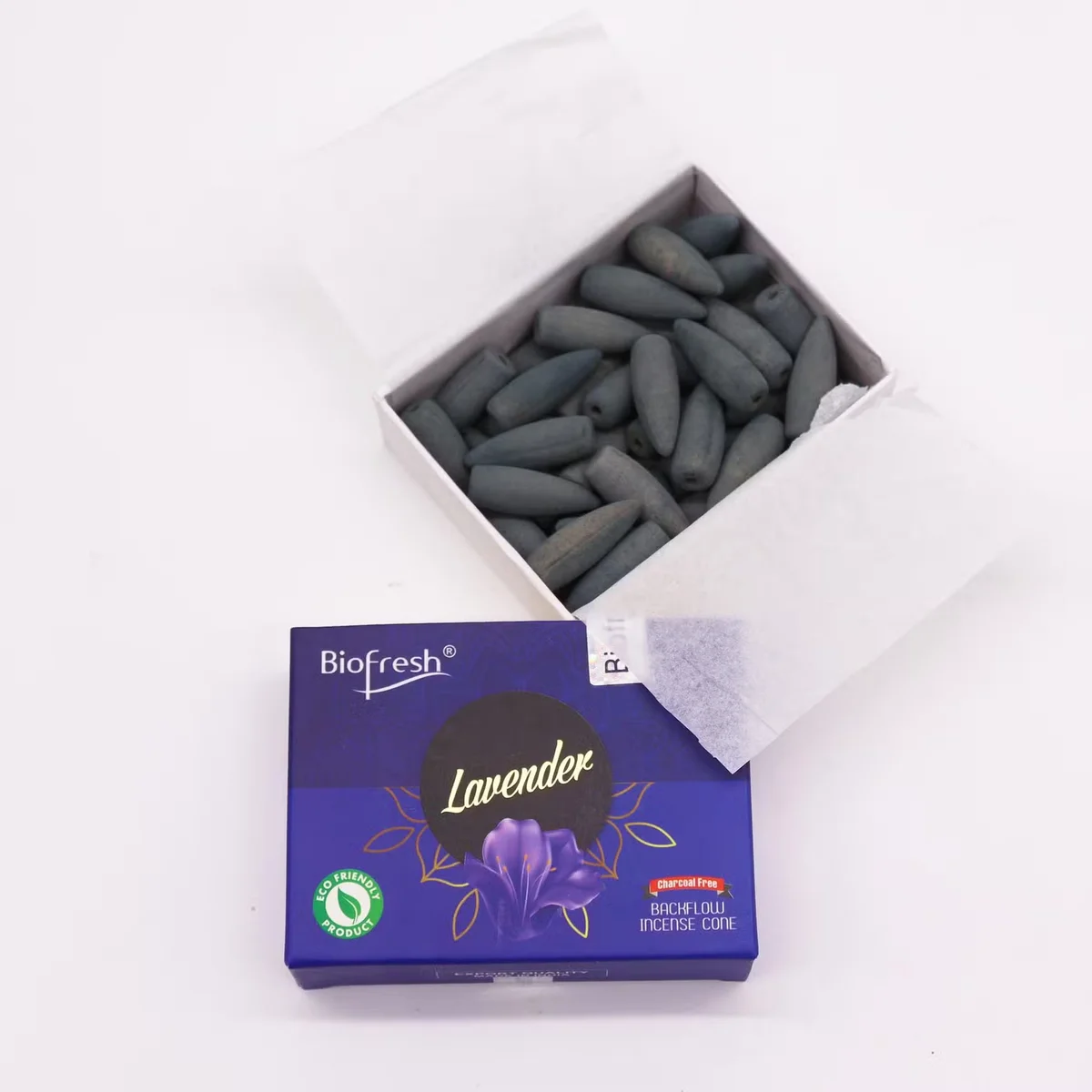 Biofresh lavender aromatherapy incense cones arranged for backflow burning on a ceramic holder with smoke effect