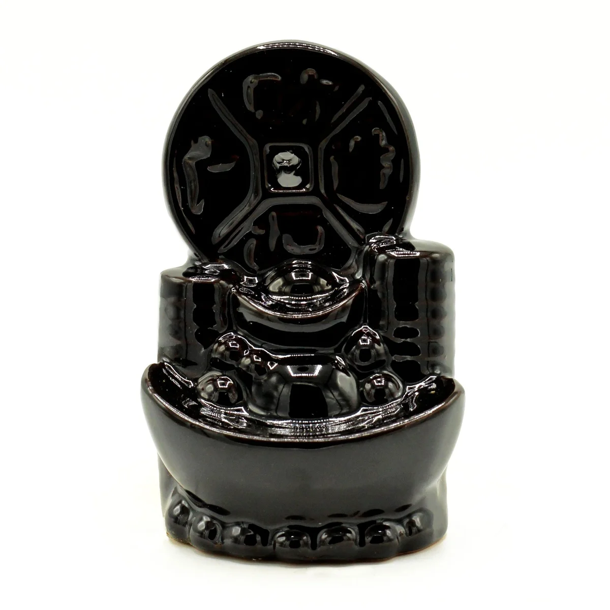 Backflow incense burner shaped like an ancient Chinese coin with detailed engravings on a wooden base