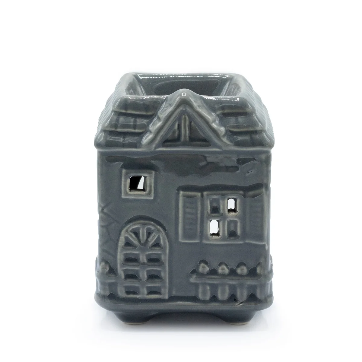 Grey oil burner for a townhouse, features a simple circular front and metallic body.