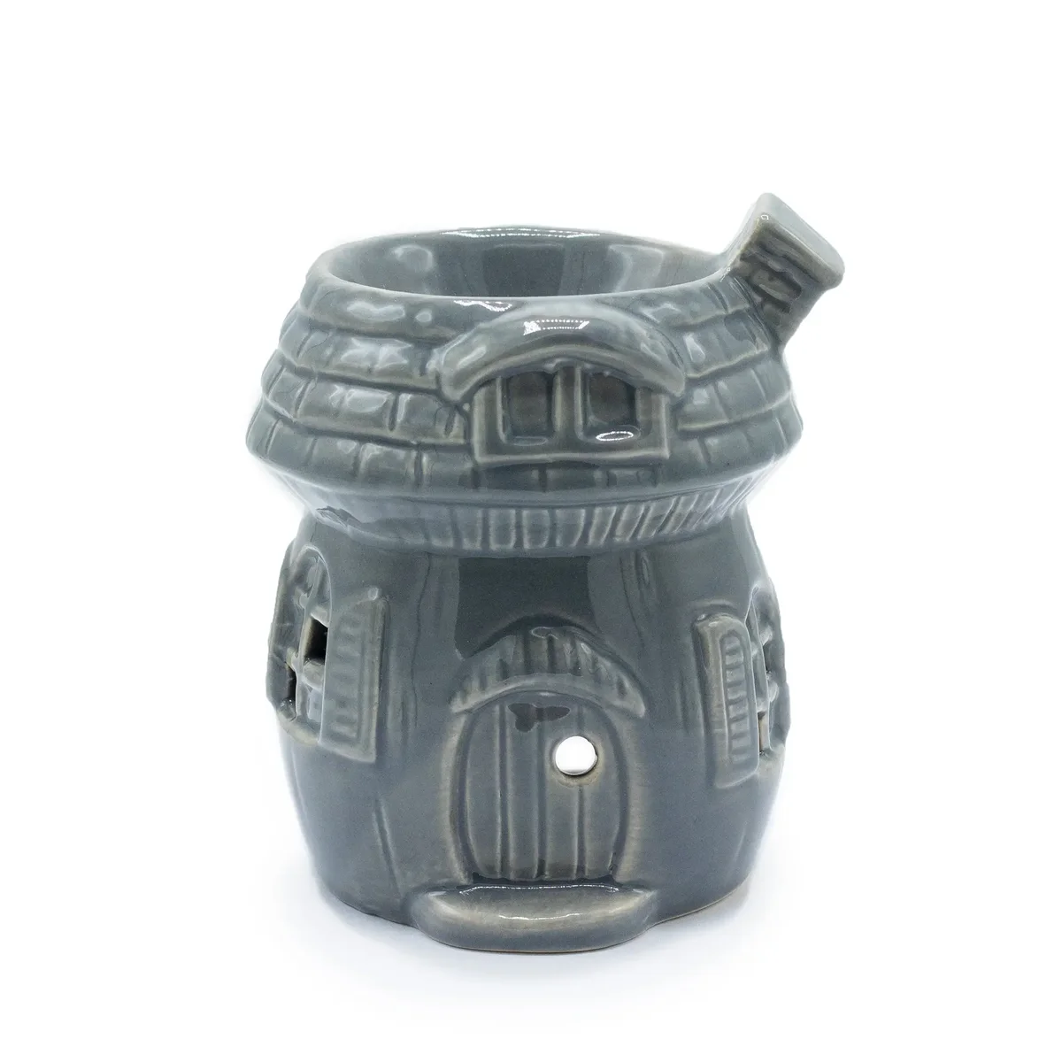 Grey oil burner shaped like a mushroom house.