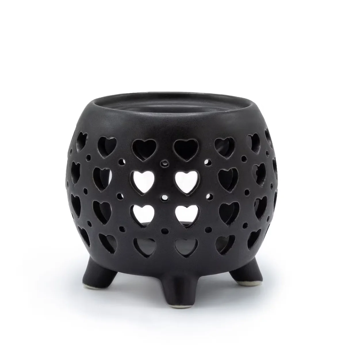 Squat pot oil burner in matte black featuring multiple hearts design.