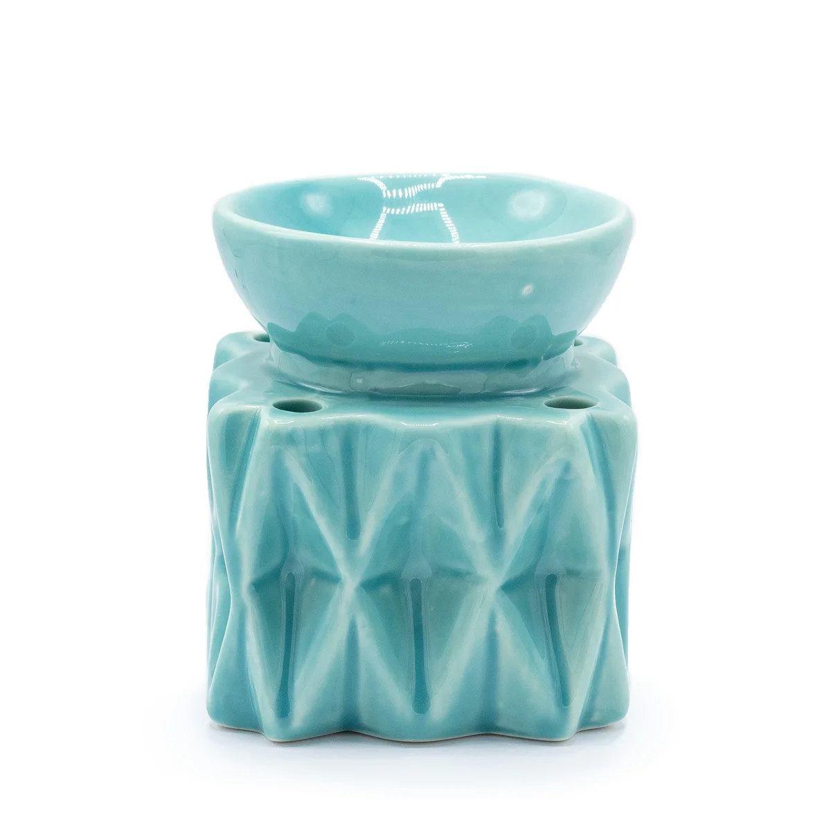 Blue geometric aromatherapy oil burner with a modern design for home fragrance and relaxation