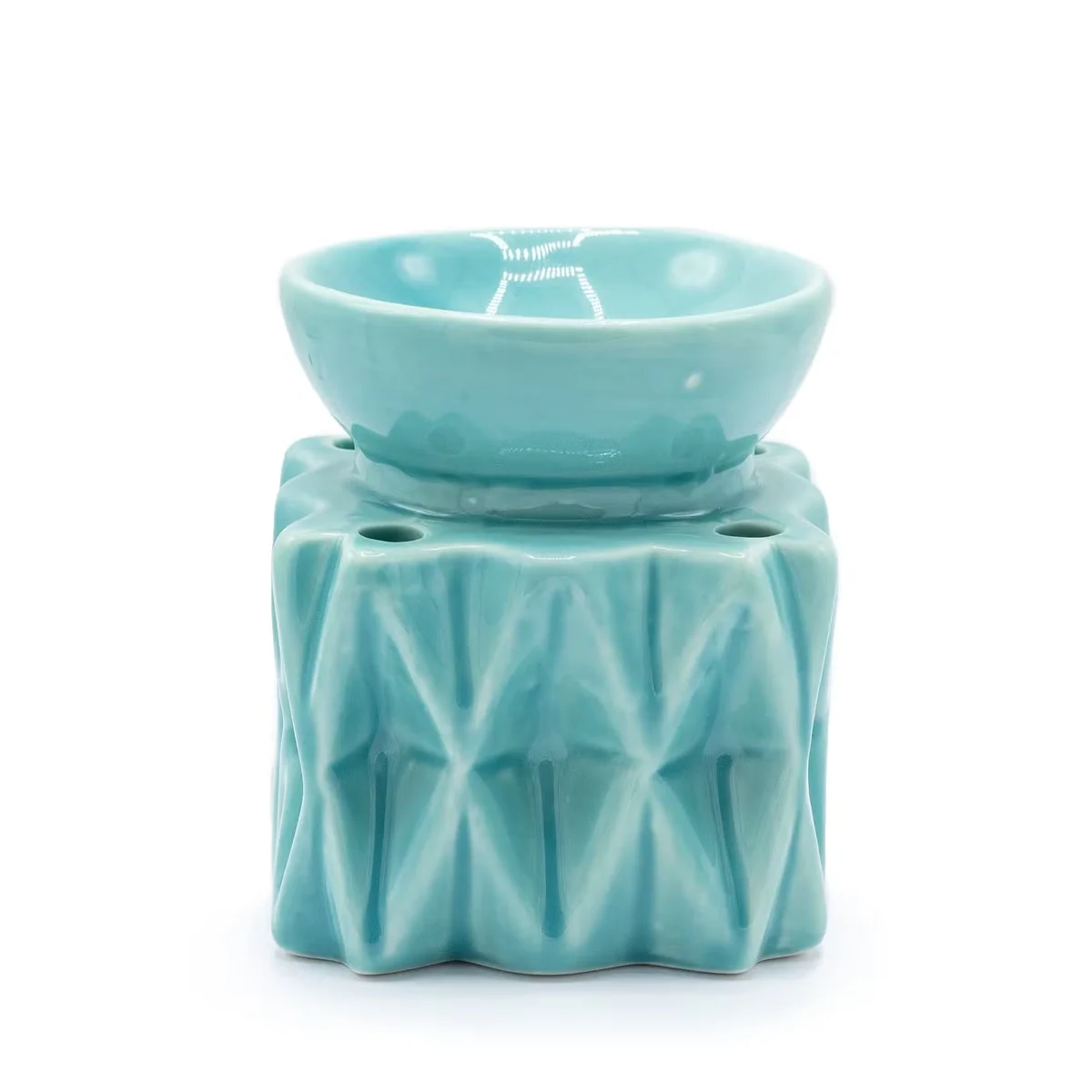 Blue geometric decorative oil burner with angular design for home fragrance and aromatherapy use