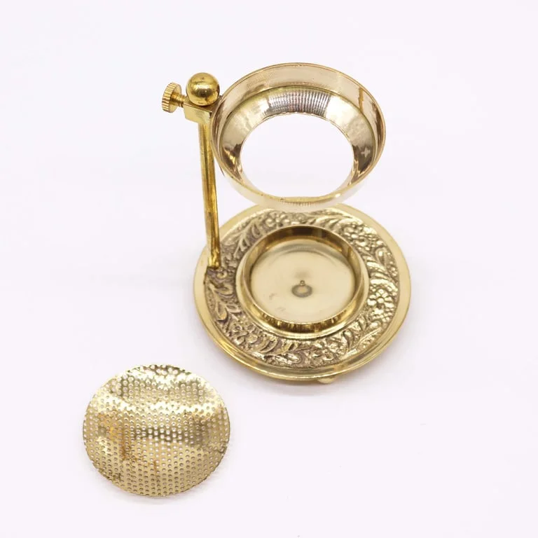 Adjustable brass resin incense warmer shown on a polished brass base with a removable circular holder
