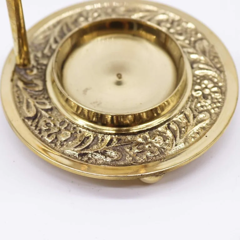 Adjustable incense warmer made of brass with resin surface, displayed upright with a small incense cone.