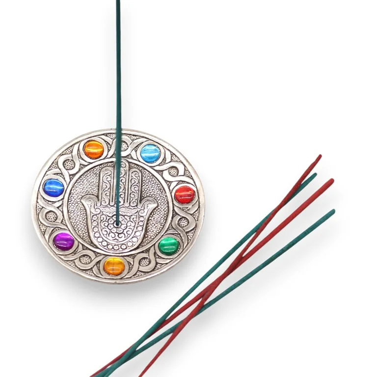 Chakra incense holder: a hamsa‑shaped container featuring seven circular designs.