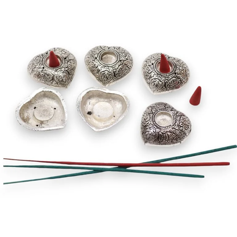 Small heart shaped decorative incense holder in plain design.
