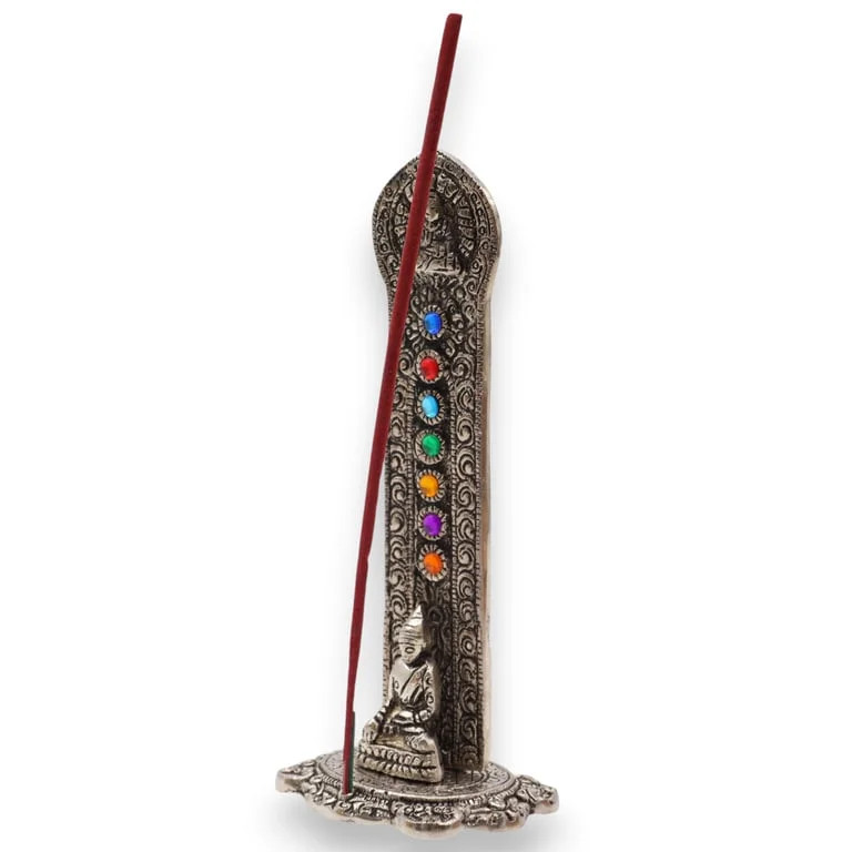Buddha statue atop a tower incense holder featuring seven chakra symbols.