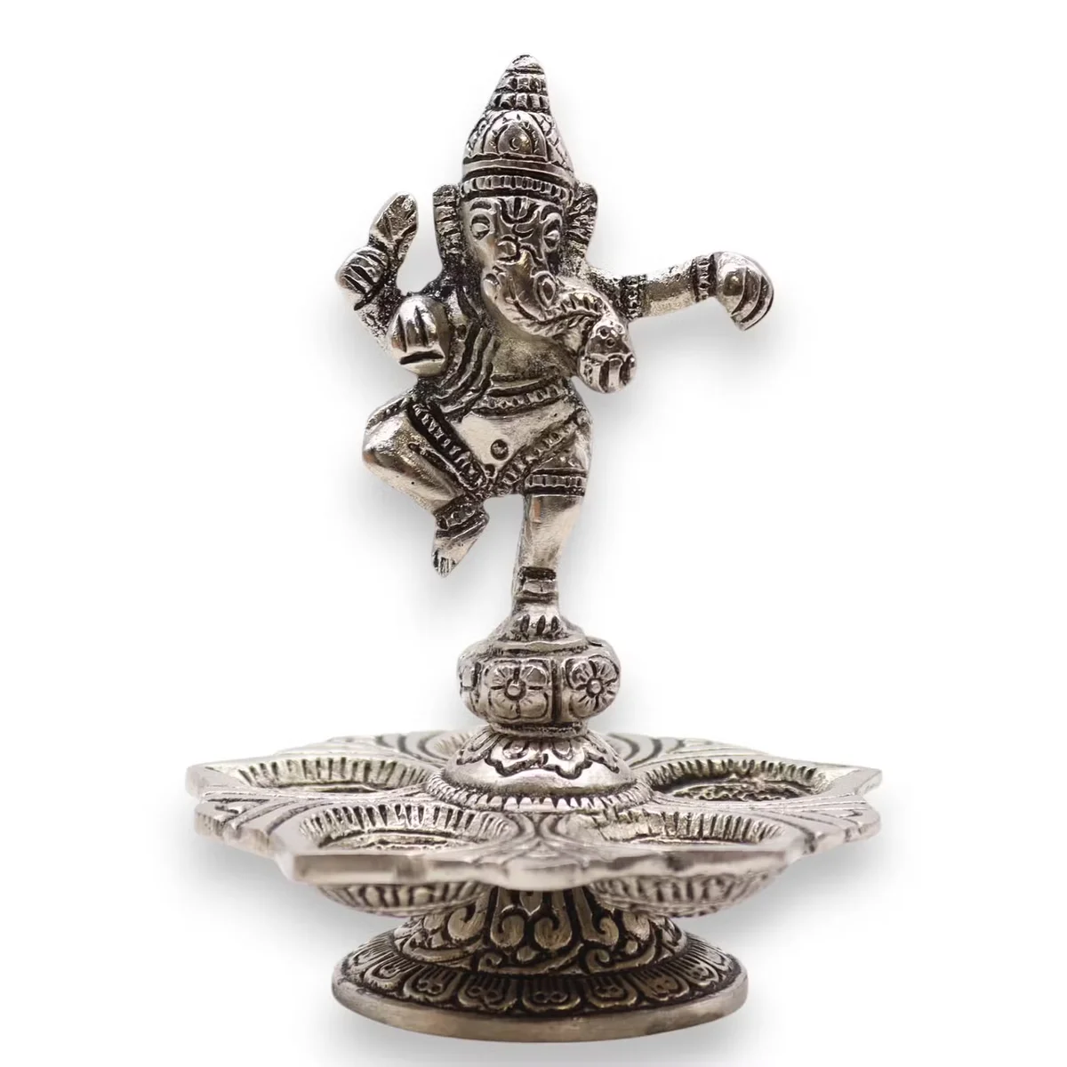 Dancing Ganesha incense holder made of resin, detailed design, home incense accessory on a wooden surface
