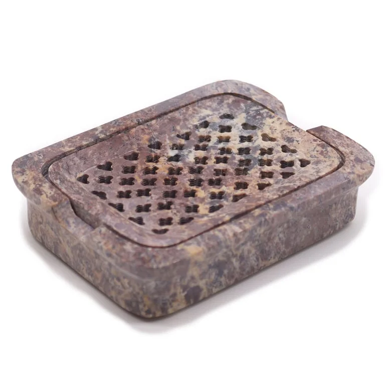 Classic square soapstone soap dish in a studio setting, featuring a small white soap bar inside