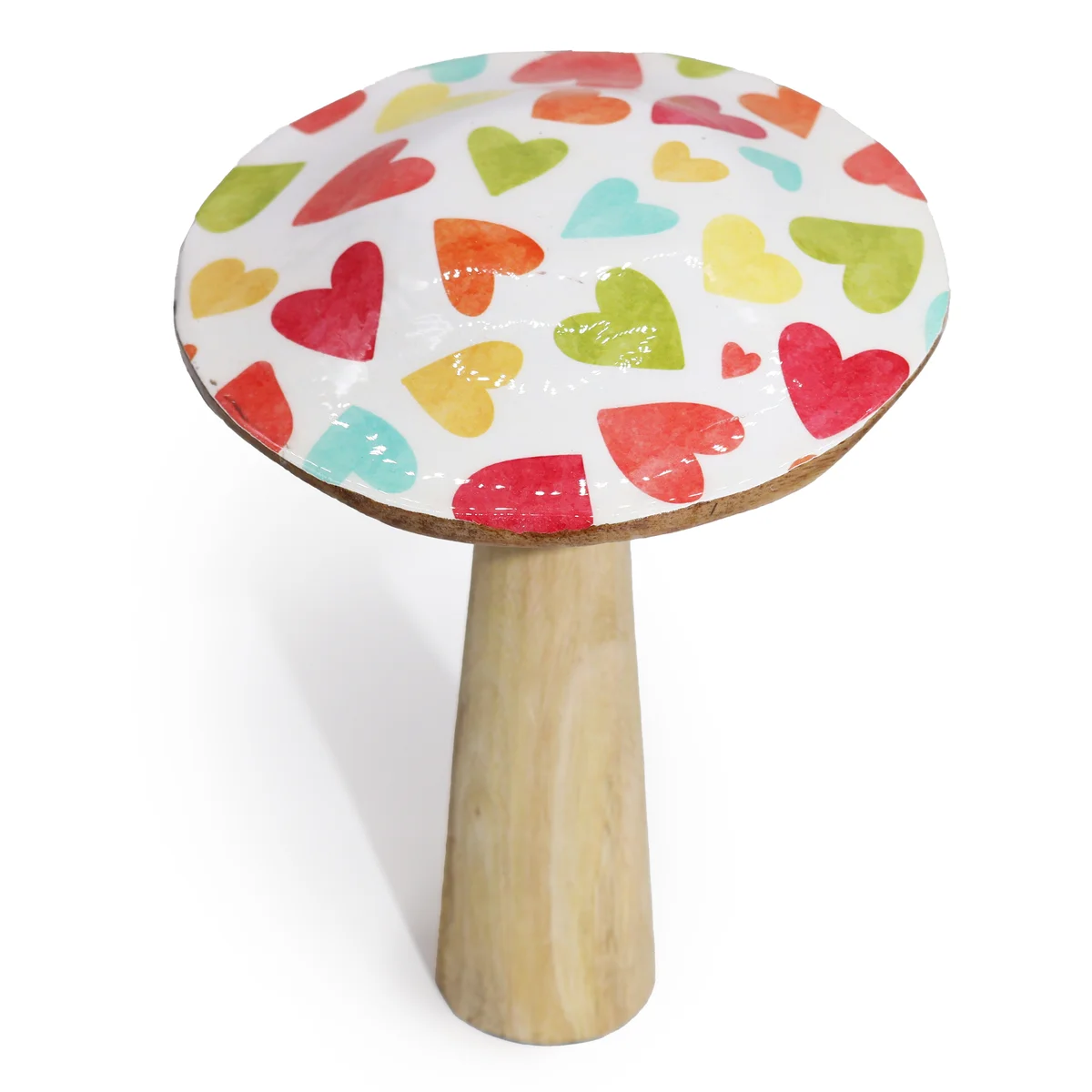 Large wooden mushroom decorated with pastel hearts decoration in soft pink, blue, and yellow on white background